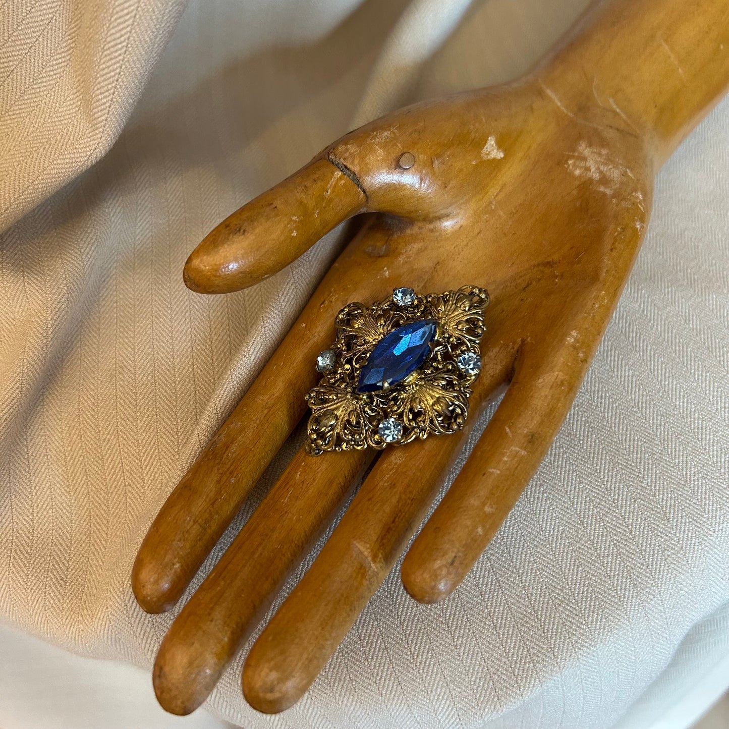 Filigree With Blue Rhinestones Brooch